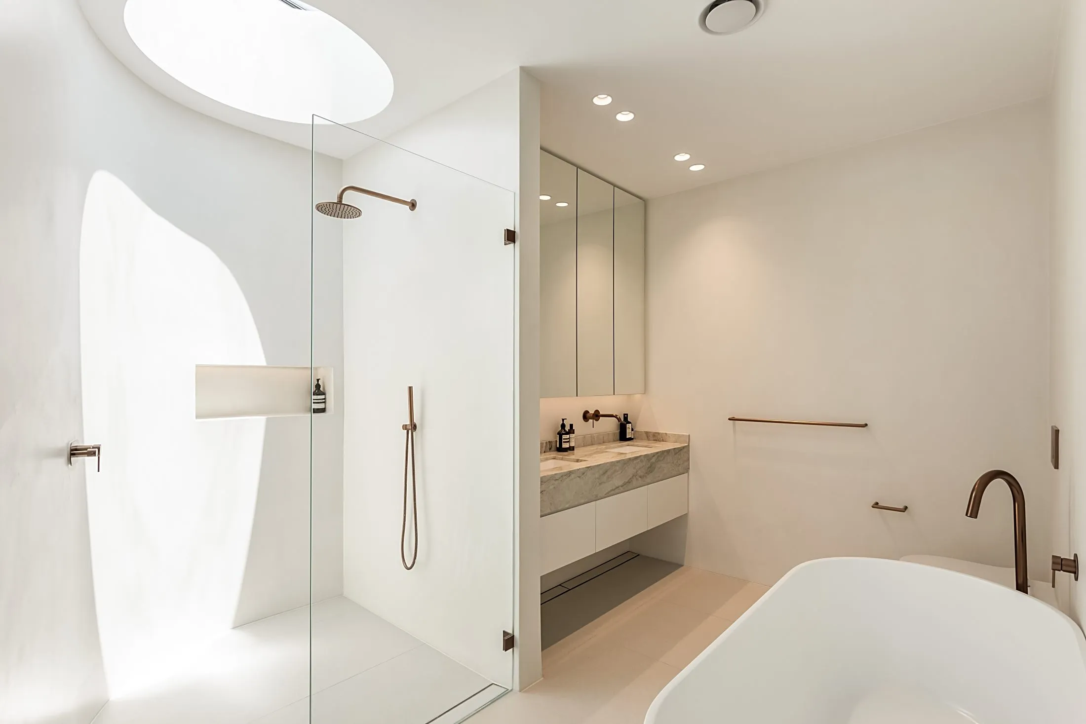 Bathroom with a floating stone-top vanity, shower and freestanding bath, Lilyfield