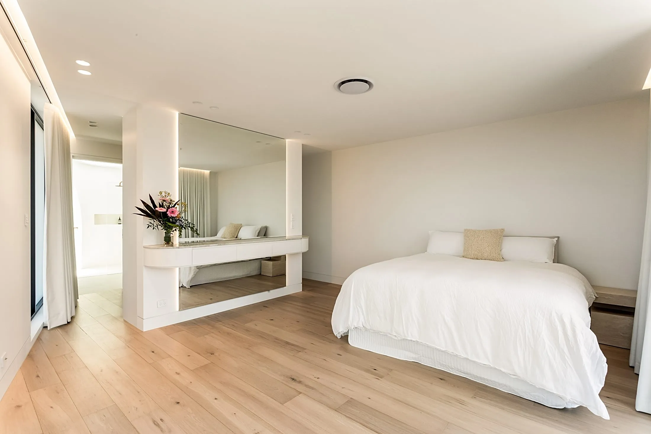 Bedroom with a floating joinery console and full-height mirror, Lilyfield