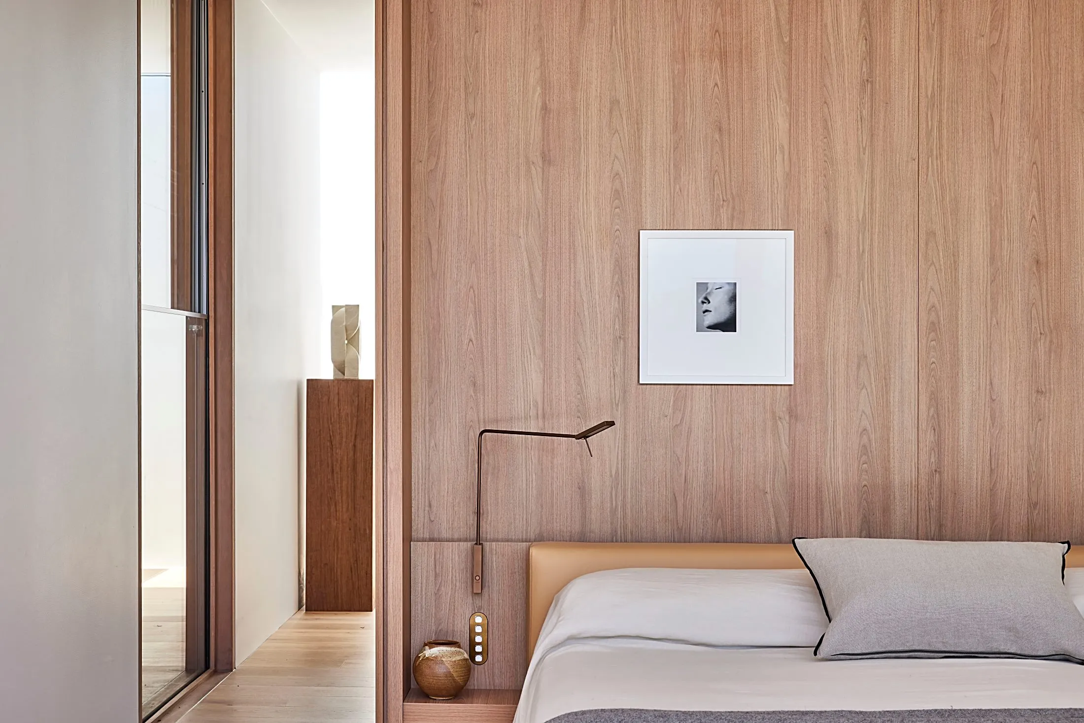 Bedroom with timber wall panelling behind the bed, Freshwater