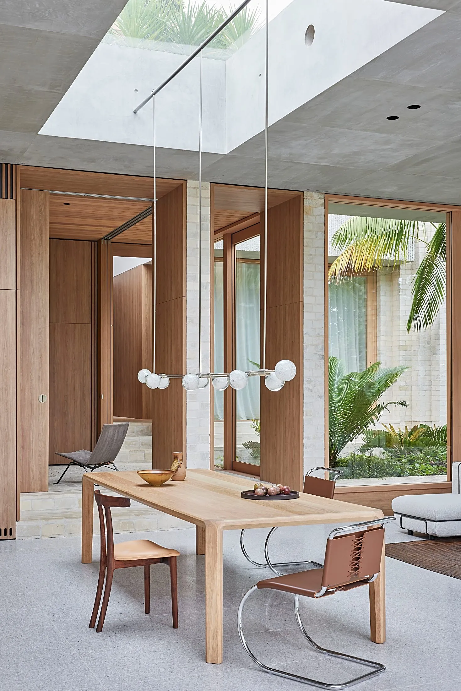 Dining space with timber wall joinery, a skylight and pendant lights, Freshwater