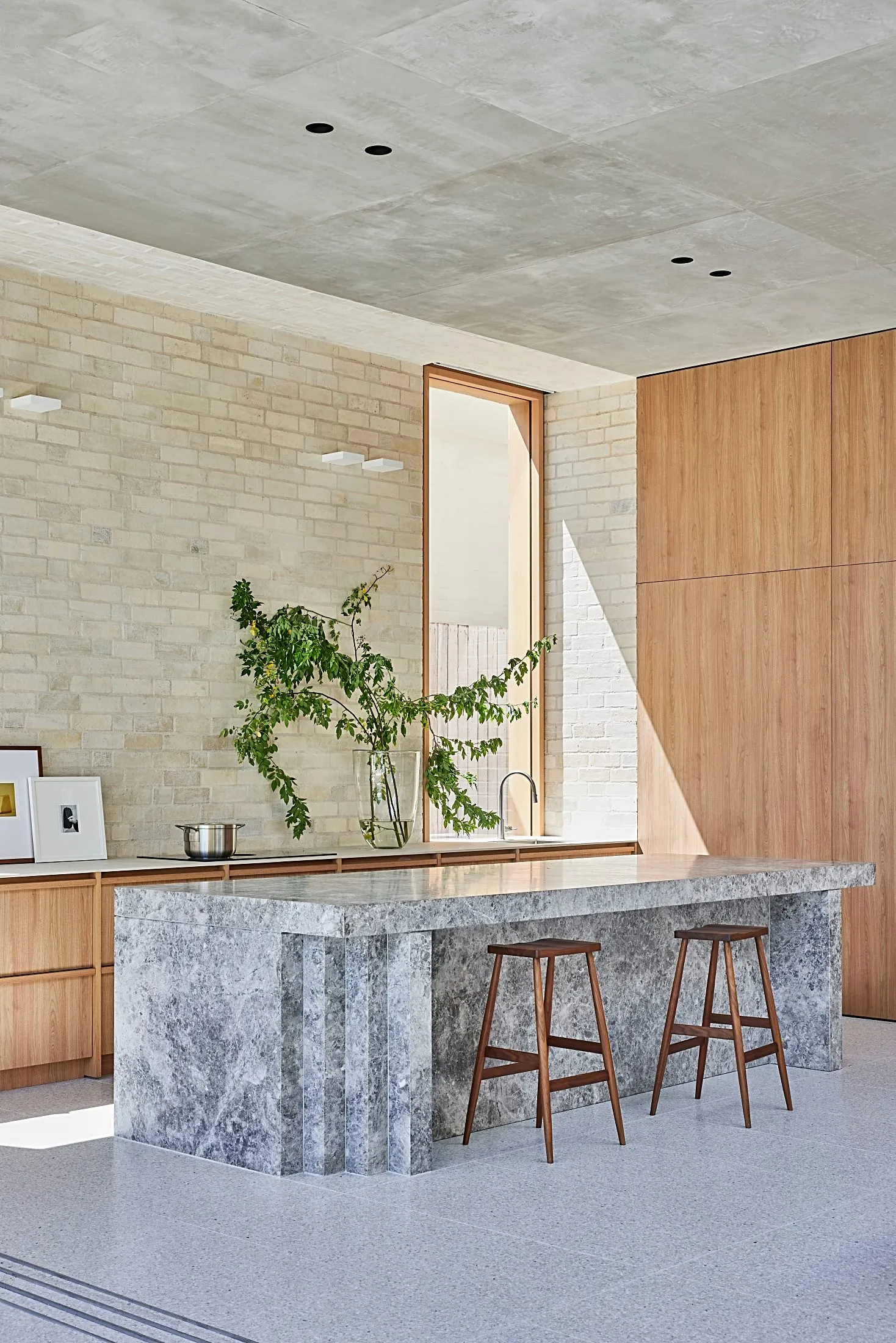 Open kitchen with a stone island and full-height timber cabinetry, Freshwater