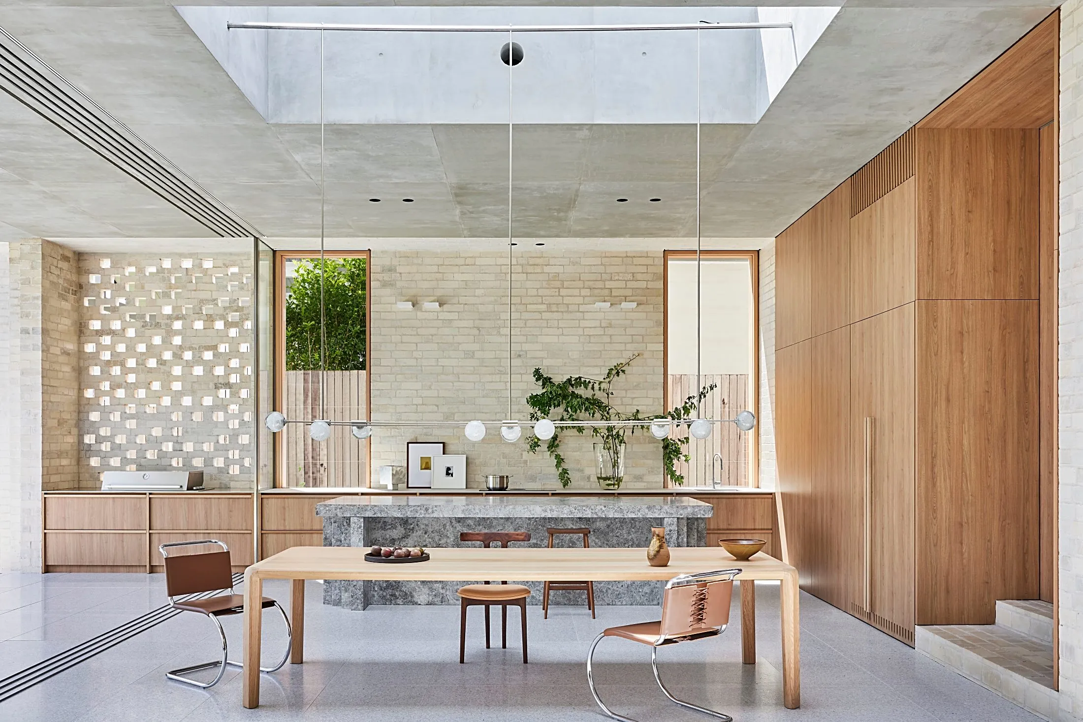Open kitchen with a stone island and full-height timber cabinetry, Freshwater