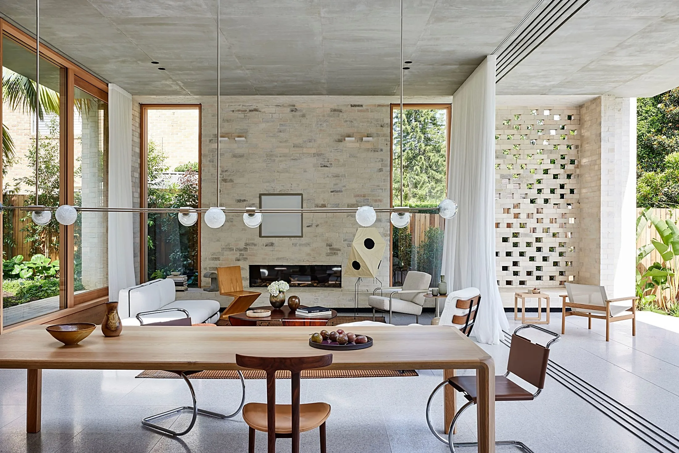 Living and dining area with brick walls and timber joinery, Freshwater