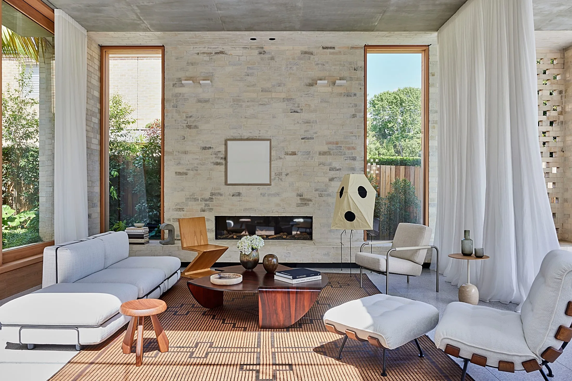 Living room with a brick feature wall, linear fireplace and timber joinery, Freshwater