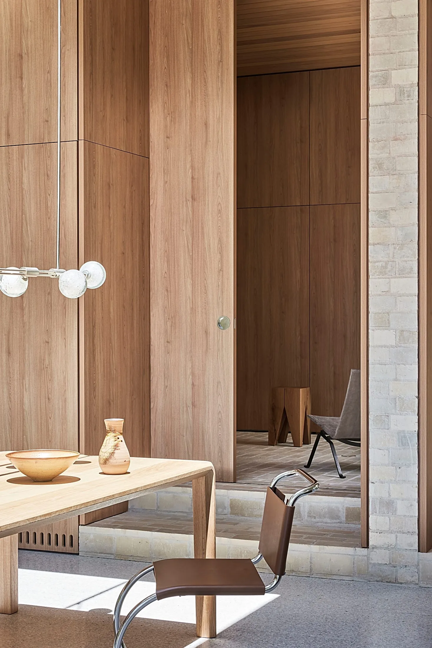 Full-height timber panelled joinery beside a dining table, Freshwater